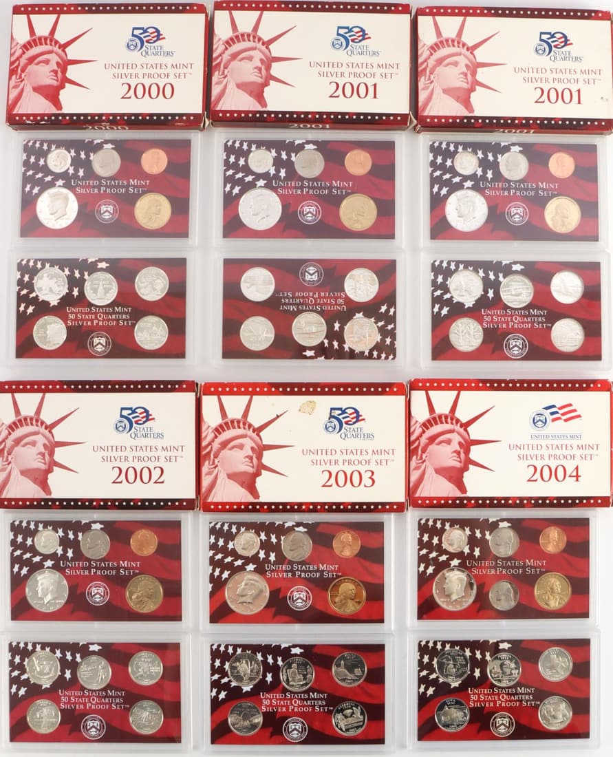 6 UNITED STATES MINT SILVER PROOF SETS: Sets include 11 proof coins each of which there are 5 silver state quarters, a silver dime and silver half dollar. Years are 2001,2001, 2004, 2003, 2000, 2002