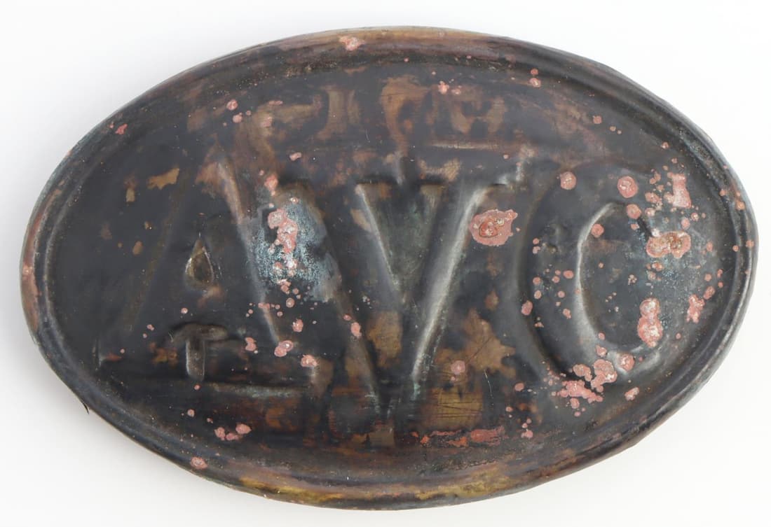 US CIVIL WAR CONFEDERATE AVC CARTRIDGE PLATE: United States Civil War Alabama Volunteer Corps cartridge plate converted to belt buckle. Brass non-magnetic oval plate with AVC to the obverse. Reverse features cooper loops soldered on. Cooper loop 