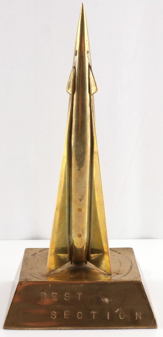 ART DECO BRASS ROCKET MODEL STAMPED BEST SECTION: Stylized model rocket in brass stands 10 inches, stamped on base "Best Section"