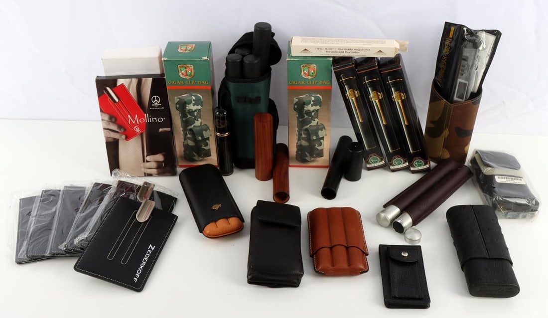 BRIZARD OSTRICH CEDAR COHIBA ROMEO CIGAR CASE LOT: New stock from Vendetta Cigar Shop and Lounge, formerly in the Lobby of the Fairmont Hotel, San Francisco, includes a black Ostrich and cedar and camo case and holder, Cohiba boxed holder in leather, 