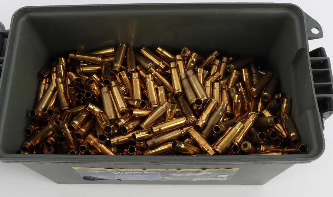 APPROX 900 7.62X39MM BRASS CASINGS: Lot of approximately 900 unprocessed and processed 7.52x39mm brass casings with various head stamps from ICC, PPU, Winchester, S&B, and more. Housed in a Bunkerhill .50 Cal ammo box.