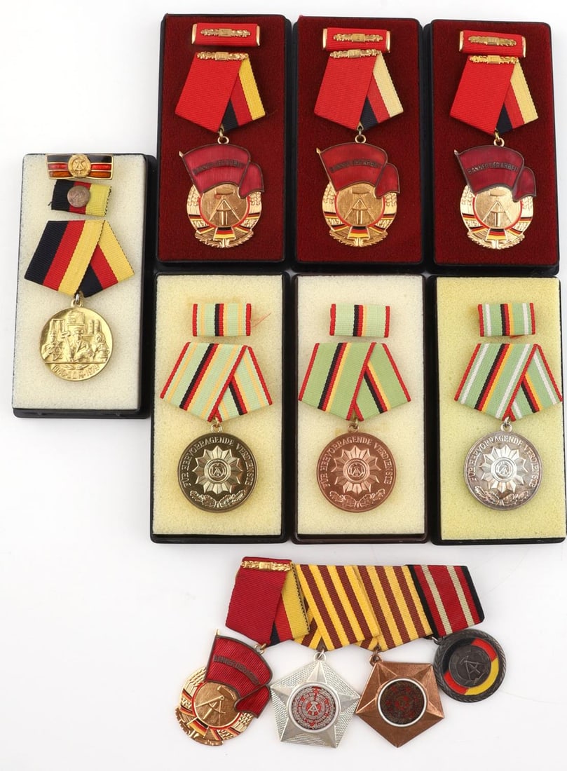 8 POST WAR RUSSIAN EAST GERMAN MEDAL & RIBBON BARS: Lot of (8) cased Post-war Russian East Germany order medals and medal bars. East German medals include (3) bronze, silver and gold Medal of Merit of Organs of the Ministry of the Interior, (3) Banner