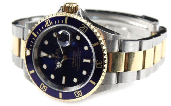 MENS 18K & STAINLESS ROLEX SUBMARINER WATCH: Men's 18K and stainless steel two tones blue Submariner Rolex wrist watch with original inner and outer boxes. Comes with cleaning cloth, anchor fob, and Rolex booklets. Size: 8 inches Weight: 144.9 g