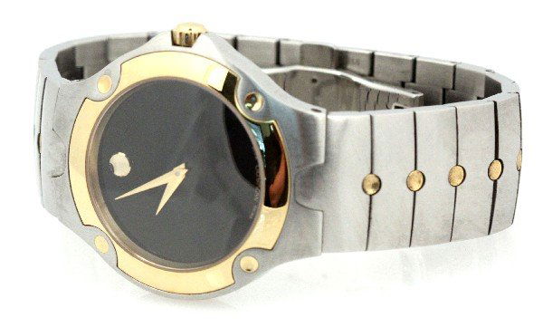 MENS MOVADO TWO TONED WRIST WATCH: Men's stainless steel two-toned Movado wrist watch. Size: 8.5 inches Weight: 124.7 g Condition: Some wear to band. Overall in very good condition. We do not warrant the working condition of time piece