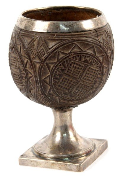 GEORGIAN SILVER CARVED COCONUT CHALICE: Silver base and silver rimmed hand carved stylized coconut chalice, unmarked sterling silver, construction suggests Georgian or early Victorian, overall height 6.25 inches, there are some hair line cr