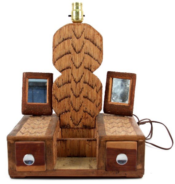 BURNT MATCH TRAMP ART DRESSER TOP LAMP: Burnt match tramp art dresser top lamp, with two pull out drawers. Measures 18 by 11 by 13.25 inches. Overall in very good working condition.