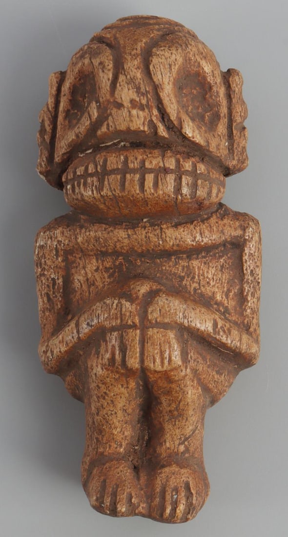 TAINO PRECOLUMBIAN BONE ANTHROPIC EFFIGY: Taino. PreColumbian. Exceptional bone, Anthropic effigy (cemi). An interesting design format with a well defined dental battery rather than gaping mouth. As we know the teeth represents an open mouth.