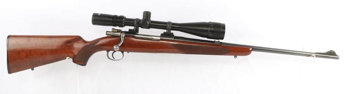 J.C. HIGGINS MODEL 51 .30-06 BOLT-ACTION RIFLE: A J.C. Higgins Model 51, .30-06 caliber, scoped bolt-action rifle. Barrel marked "J.C. Higgins, Model 51, CAL. 30-06", "EB" and "ACTION-Made in Belgium". Butt plate marked J.C. Higgins. Rifle includes