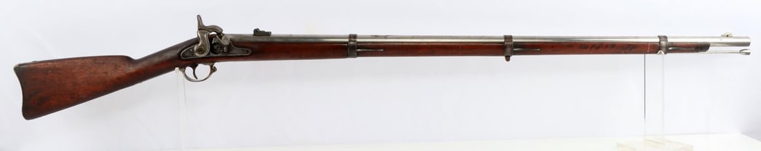 US SPRINGFIELD MODEL 1855 PERCUSSION RIFLE MUSKET: A U.S. Springfield Model 1855 .58 Caliber Percussion Rifle Musket. Wooden frame has "TJM" carved on left side. Right side's lock is dated "1860" and US Springfield along with US Eagle insignia. The to