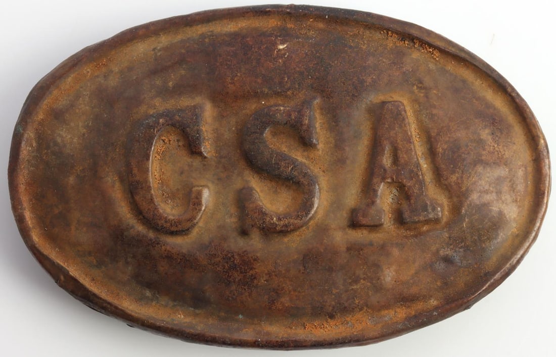 US CIVIL WAR CSA OVAL CARTRIDGE BELT PLATE: United States Civil War Confederate States of America cartridge belt plate. Brass non-magnetic oval plate featuring CSA to the front with puppy paw hooks. Very good excavated condition and measures 3x