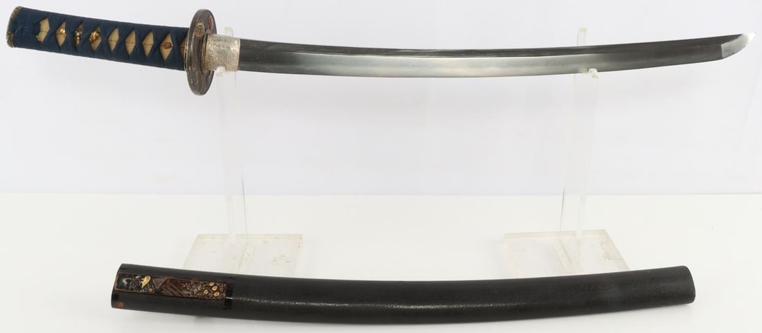 EDO TO WWII IMPERIAL JAPANESE WAKIZASHI SWORD: In full polish. Bright hamon with visible hada. Signature present on tang. Grip has shark skin with cotton wrap. Menuki appear to be upper class leaders. Light chipping near tip of the blade. Few tire
