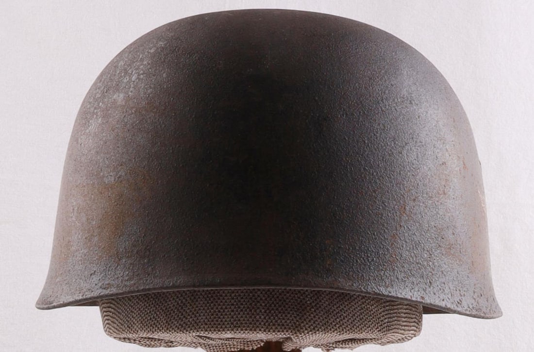 WWII GERMAN REICH PARATROOPER M38 HELMET: Exterior in good condition with double decals-Luftwaffe & national colors shield. Liner & chinstrap intact. Stamp on liner reads "Karl Heister Berlin C.2" with the rest being illegible. The size stamp