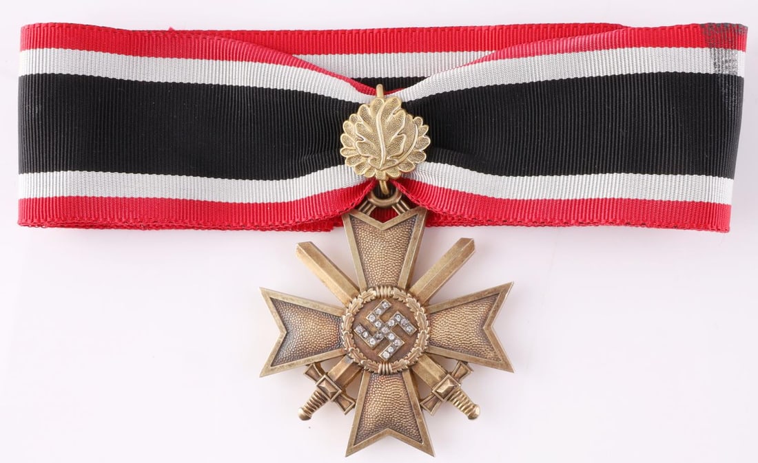 WWII GERMAN KNIGHTS CROSS OF WAR MERIT MEDAL: WWII German Third Reich Knights Cross of War Merit medal with swards in gold and diamonds. 800 marked on the back of the ring. Rare prototype order with oak leaves and diamonds. Size is 2.5 x 2.5 inch