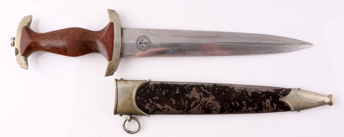 WWII GERMAN REICH SA GEBRUDER HELLER DAGGER: â€œGebruder Heller Schmalkalden” makerâ€™s mark on reverse of blade. Cross guard marked with â€œMi” Gau. Eagle and roundel are flush. Grip with some wear. Blade with surface w