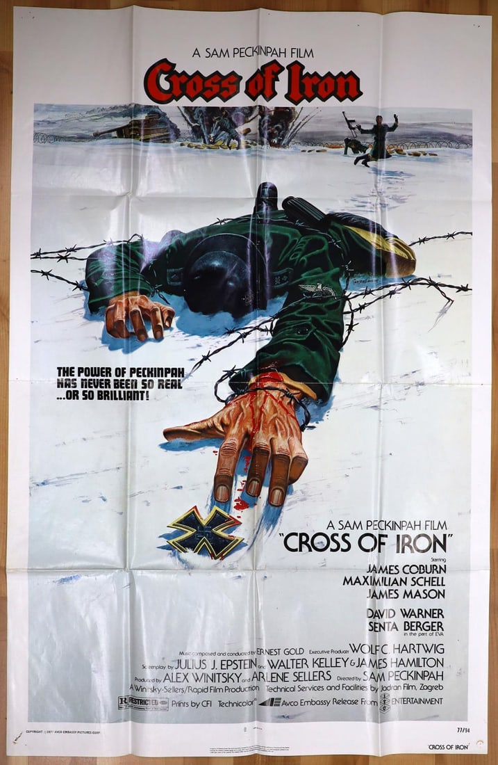 1977 CROSS OF IRON ONE SHEET POSTER SAM PECKINPAH: 41 inches tall by 27 inches wide. Fold creases all along the poster. A few small holes, no rips.