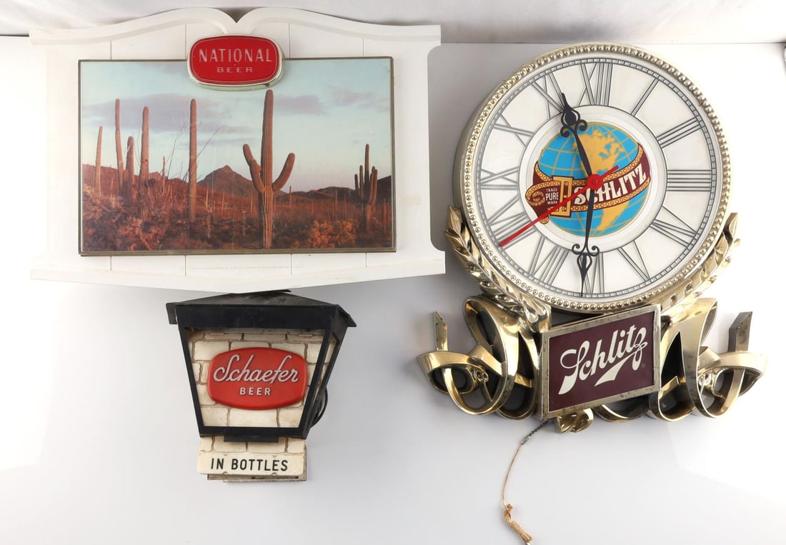 3 LIGHTED BEER SIGNS SCHLITZ NATIONAL SCHAEFER: All work, the Schlitz second hand is loose, it measures 14 x 17, Schaefer 7 x 7 inches, the National 10 1/2 x 17 inches.