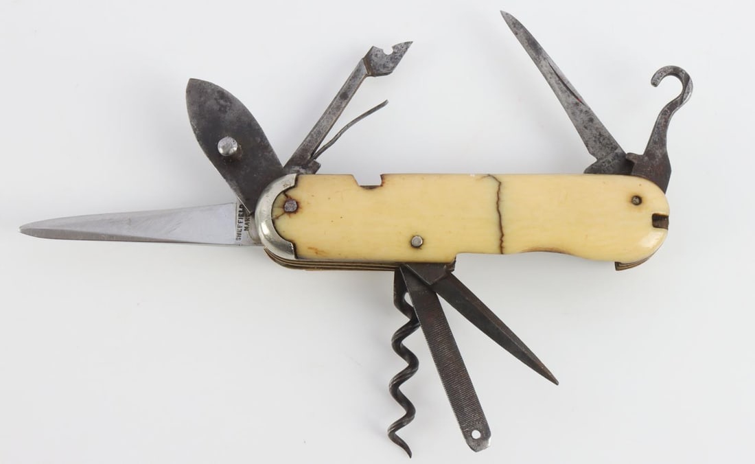 AMERICAN CIVIL WAR POCKET KNIFE CLEMENT SHEFFIELD: Antique American Civil War era Fine Folding Knife & Tools by CLEMENTS SHEFFIELD. Measures 5 3/4 inches fully extended. Grip plates are made of tusk. Very good condition with age wear.