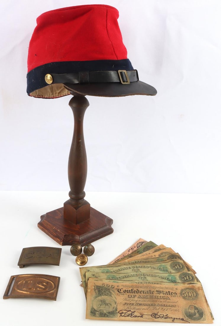 18 UNITED STATES CIVIL WAR REENACTORS LOT: Assorted lot of 18 reenactor items representing the United States Civil War. Two belt buckles (1 CSA and 1 US). Three CSA uniform buttons. 14 replica Civil War period money. One CSA Kepi artillery cap