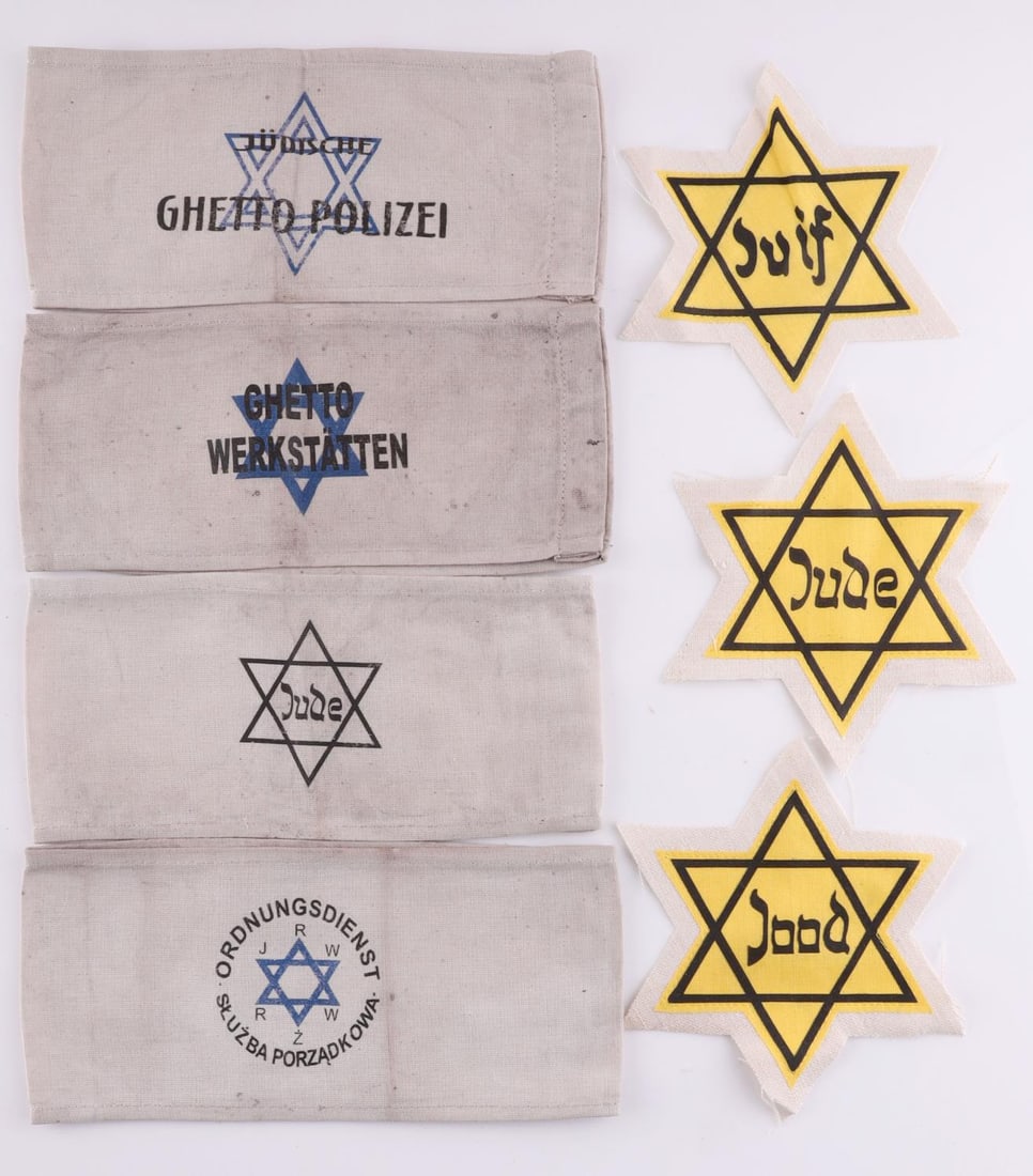 7 WWII GERMAN HOLOCAUST JEWISH GHETTO ARMBAND LOT: Lot of seven (7) WWII German Reich Holocaust period Jewish Ghetto armbands and Stars of David. Armbands include Star of David/Jude, Ghetto Workshop, Jewish Ghetto Police, and lastly Warsaw Ghetto Secu