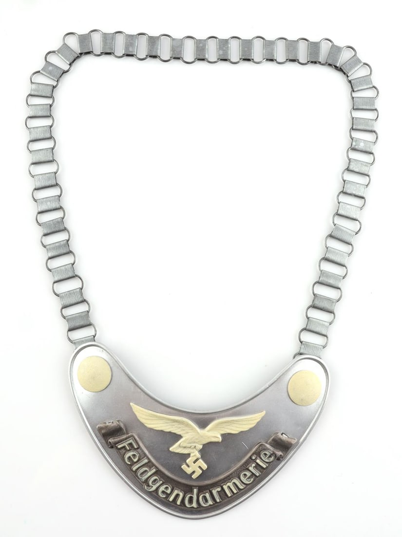 WWII GERMAN REICH LUFTWAFFE FIELD ZHANDARM GORGET: A WWII German Reich Luftwaffe Field Zhandarm gorget with chain. Marked 1935 along with Luftwaffe eagle on the backside. Cloth backing. Chain length approx. 25 inches. Good condition. Unauthenticated,