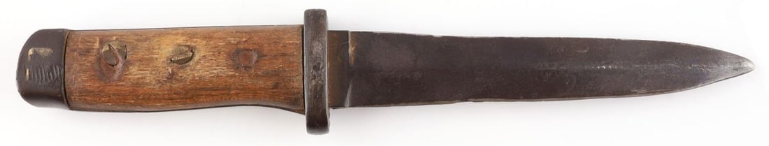 WWII GERMAN COMBAT TRENCH KNIFE BAYONET: Combat bayonet also used as a fighting knife. Steel blade with wooden grip plates. Measures 9 1/2 inches overall. Marked WuK. Also marked on the crossguard but difficult to discern. From Ortona, Italy