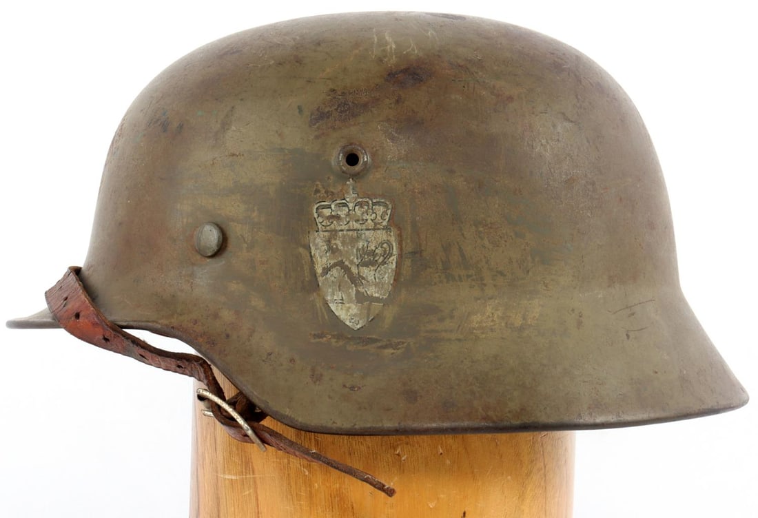 WWII GERMAN THIRD REICH M40 PARTISAN HELMET: Perhaps Dutch Partisan, has lion Rampant right shield decal, very good M40 helmet, with 8 finger size 58 liner with chin strap rear internal stamped 5068. left ear SE 66, nice original example.