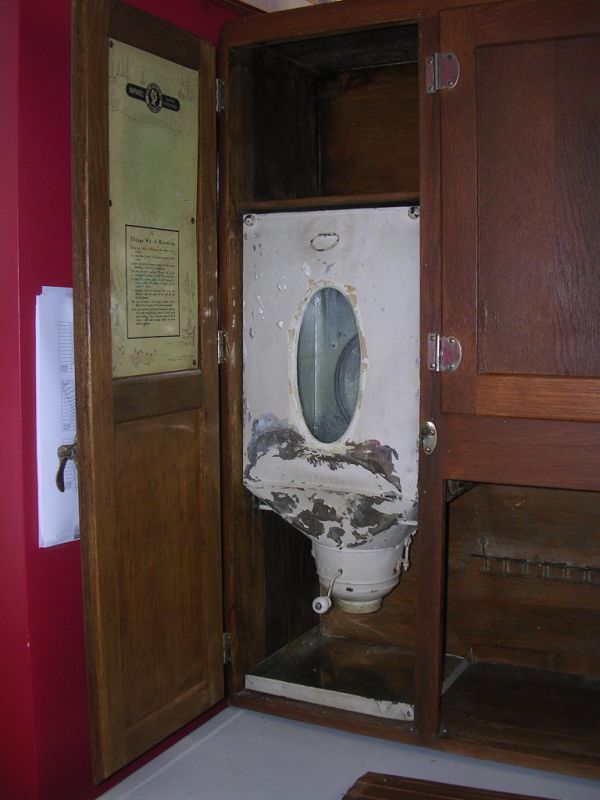 10094: ANTIQUE HOOSIER CABINET 1918 PAT. NAPANEE DUTCH