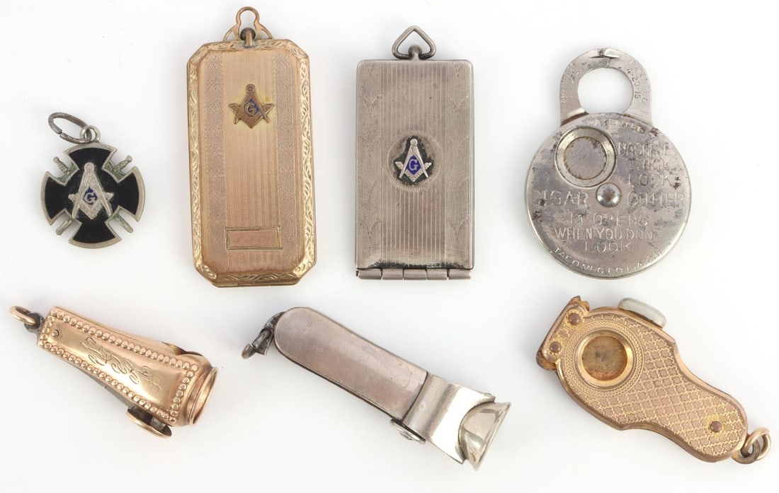 LOT OF 7 MASONIC CIGAR CUTTER AND PAPER HOLDERS: Lot features gold fill and sterling cutters and paper holders. Comes with small Masonic pendant. Measurements range 3/4 - 1 7/8 inches. Very good condition.