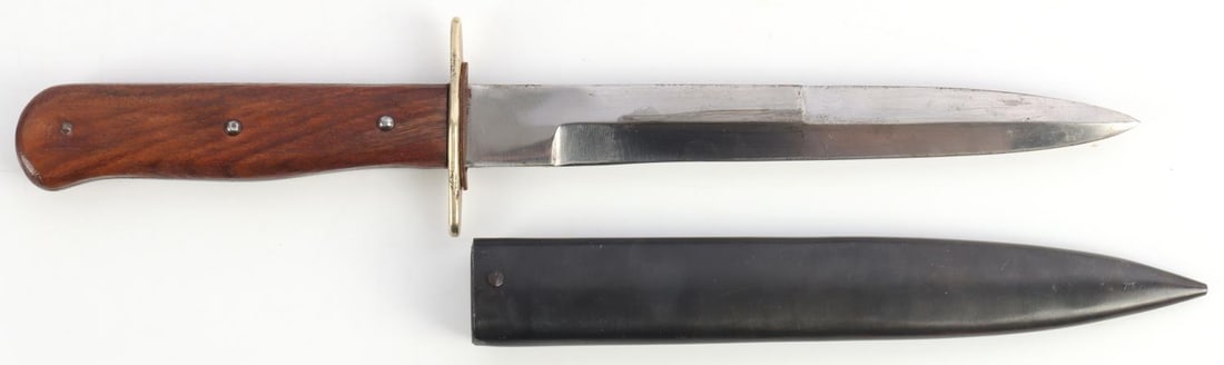 WWII GERMAN REICH COMBAT BOOT KNIFE & SCABBARD: WWII German Reich Combat Boot Knife and metal scabbard. Pair of wooden handles. No markings on scabbard or blade. Blade length approx. 6 3/4 inches, full knife length with scabbard approx. 11 3/4 inch
