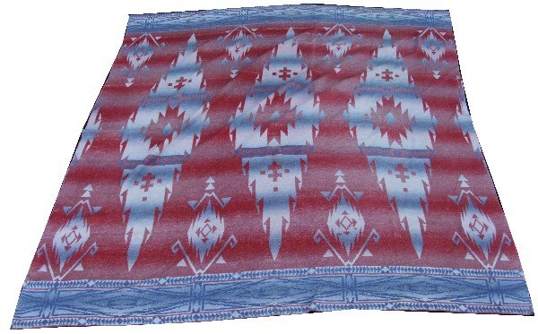 SIOUX TRADE WOOL PENDLETON BLANKET: Sioux trade wool Pendleton blanket, features colors red, blue, and white. Measures approximately 68 by 68 inches. Over all in good condition with normal wear and some staining.