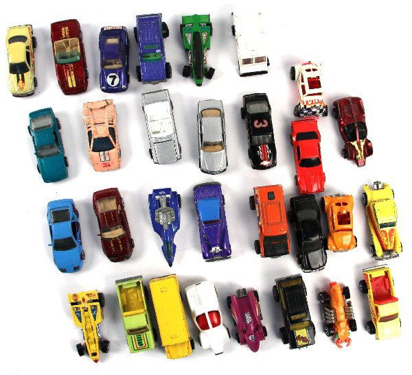 30 VINTAGE 1980S HOT WHEELS: 1980-1989 Hot Wheels die-cast cars including'37 Bugatti, white Baja Bug, Color-change Lamborghini Countach, and others. All are loose and in played condition. Overall condition is fair - very good.