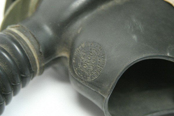 WWII US GAS MASK WITH FILTER AND HOSE: WWII US gas mask with filter canister and hose marked "AD3V5 4-44 568 GMS." Masked marked "US U." Overall in good condition.