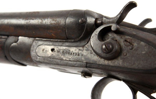 ANTIQUE W. RICHARDS SIDE BY SIDE SHOTGUN: 19th Century W. Richards external hammer side by side shotgun. Belgian proof marks. Bore is dark and barrels show substantial surface rust. Hammers lock back, but gun is likely unsafe to fire. Stock i