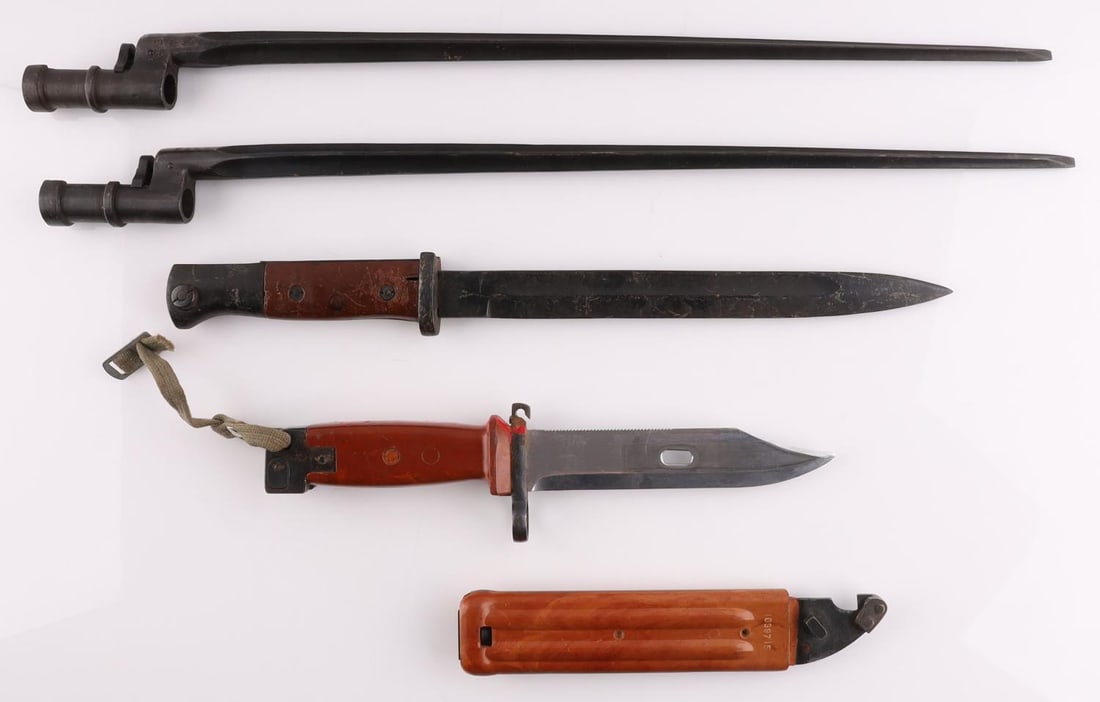 LOT OF 4 MOSIN NAGANT AK47 AND MAUSER BAYONETS: Lot features 2 Mosin Nagant bayonets with serial numbers, an AK-47 bayonet, and the a Mauser bayonet. Measurements range 12 3/4 - 20 inches. Very good condition.