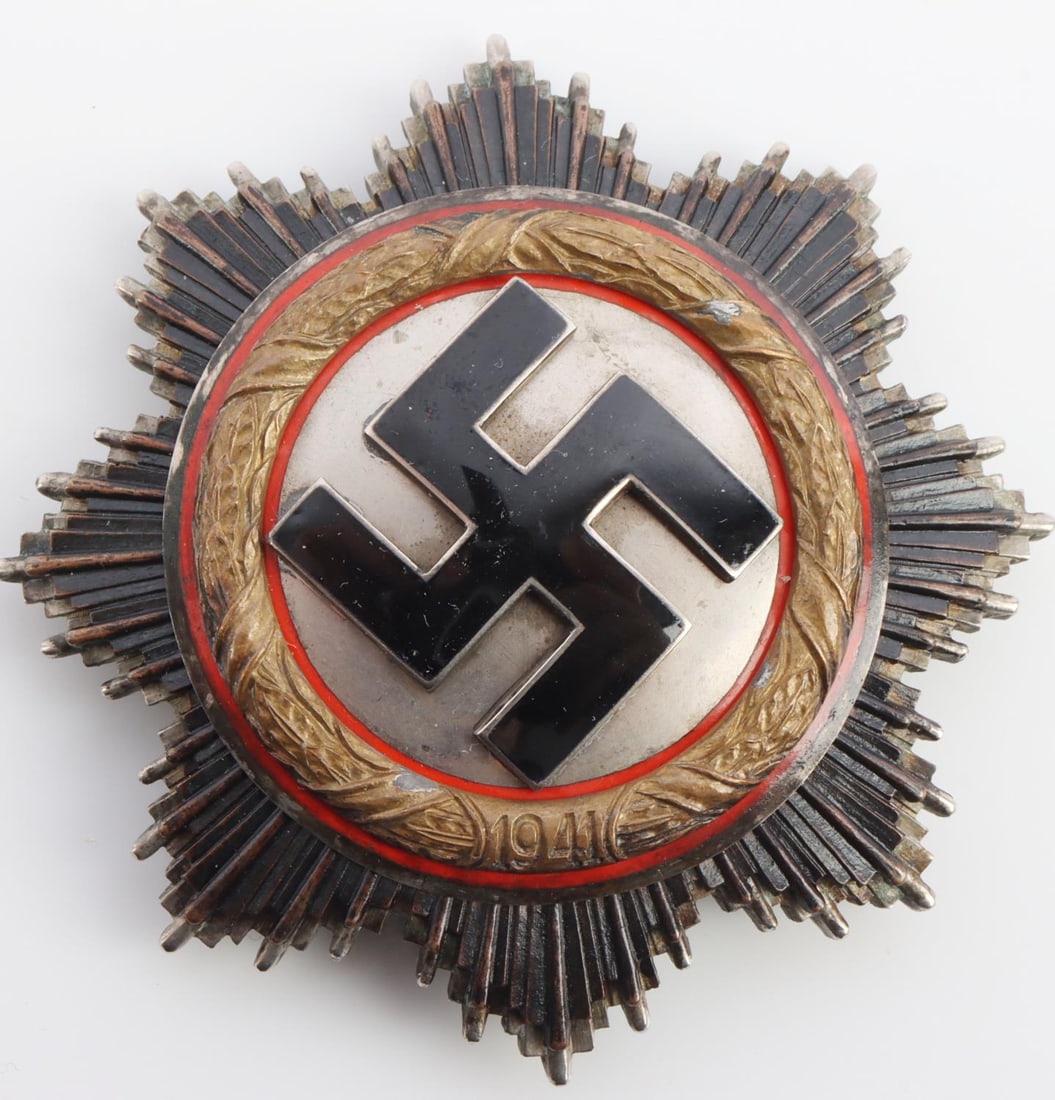 WWII GERMAN REICH GOLD ORDER OF THE GERMAN CROSS: A WWII German Reich Gold Order of the German Cross(Deutches Kreuz or “DK”) medal. Vertical pin back stops at ninety-degrees. Pin back is stamped "1" for marker Deschler &Sohn. Four rivets on rever