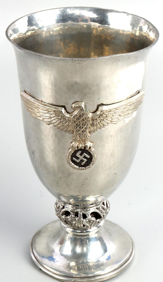 WWII GERMAN REICH NSDAP EAGLE SILVER CHALICE: WWII German Reich NSDAP Party Eagle silver chalice. Cup features the NSDAP party eagle on the front. Underside is marked with maker(partially rubbed odd), visible is, 1130 with an MR stamp. Chalice is