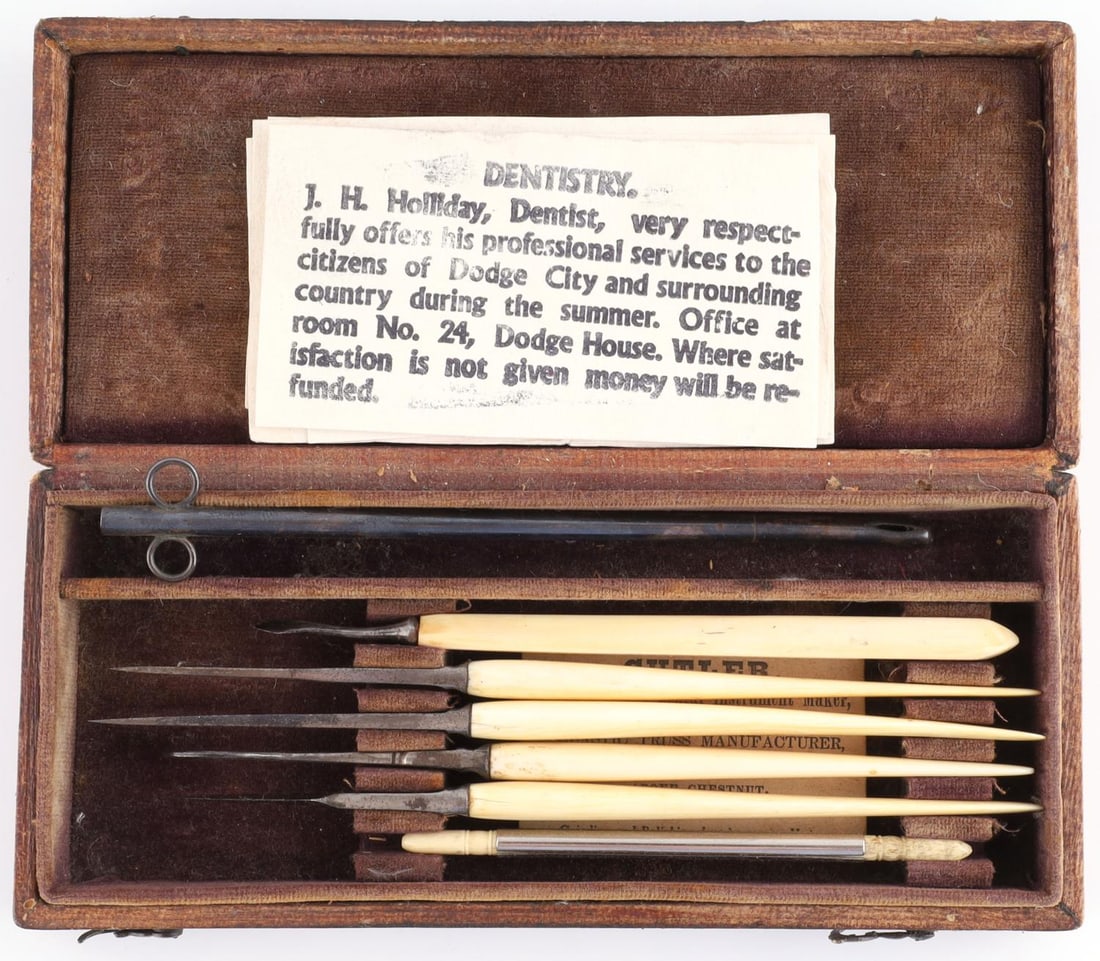 ANTIQUE DOC HOLIDAY DENTAL SURGICAL SET: Ivory gripped surgical/dental implements. Comes in box marked J. H. Holiday. Comes with business cards. Box measures 7 inches. No international shipping. Know your state laws prior to bidding. This lo