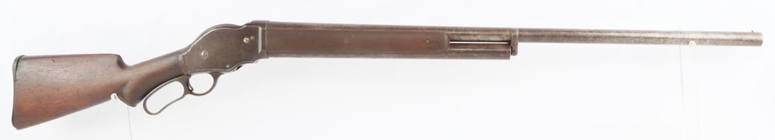 WINCHESTER MODEL 1887 LEVER ACTION 10 GA SHOTGUN: Bore partially bright with many dark spots, surface wear and pitting. Mechanically very good, functions without issue. Wear and finish loss throughout exterior of shotgun. WRA Co. marked on left of re