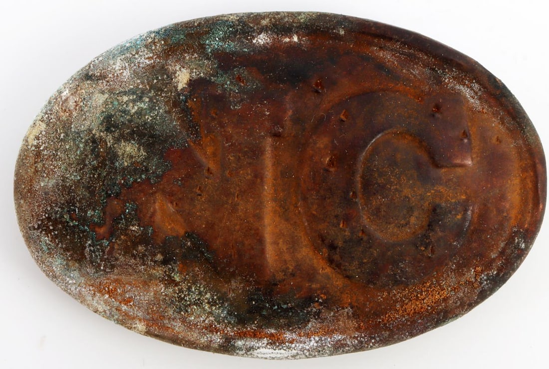CIVIL WAR N.C. NORTH CAROLINA BELT BUCKLE: Brass belt buckle with lead filled back. Puppy paw belt hooks on reverse. Measures 2 1/8 X 3 1/8 inches. Very good condition. Collection acquired from a family who searches battlefields for belt buckl