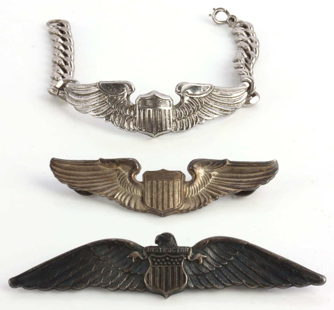 WWII USAAF PILOT INSTRUCTOR WINGS & BRACELET: Lot features a pilot instructor badge, aviator badge marked sterling, and a sweetheart bracelet marked sterling. Measurements range 2 7/8 - 8 inches. Very good condition.