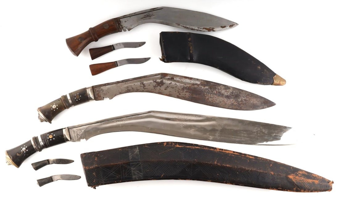 LOT OF 3 GURKHA KUKRI KNIFE WITH SHEATHS 1 WITHOUT: Lot of 3 Gurkha Kukri knives. 1 Gurkha Kukri large knife with sheath included 2 small knives. All 3 knives are in very good condition. 1 mid sized Gurkha Kukri knife in good condition without a sheath