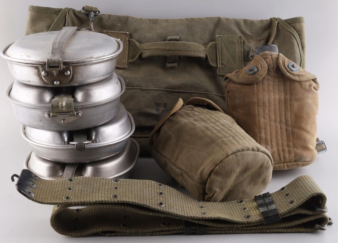 8 WWII US ARMY PARATROOPER MUSETTE BAG & CANTEENS: Lot of eight (8) US Army field gear items including a paratrooper musette bag, two water canteens with canvas covers, four meat can tins marked US (some dated for WWI) and lastly a webb belt. Items co