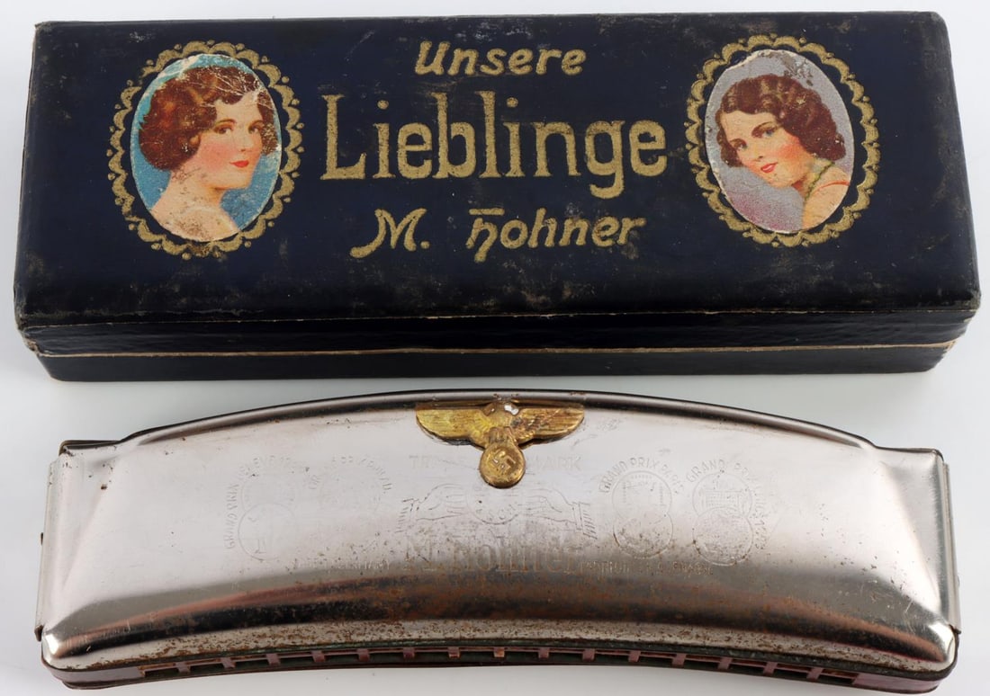 WWII GERMAN REICH NSDAP HEER ARMY HARMONICA & CASE: WWII German Reich NSDAP Heer Army Harmonica including original case. Marked M. Hohner for maker. Made in Germany. Size approx. 5 inches. Harmonica still produces sound. Good condition. Unauthenticated