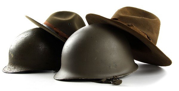 SPANISH AMERICAN TO VIETNAM HEADGEAR HELMET LOT: Collection of military head gear to include, trooper style hat with cord, 1902 DI style hat; WWII M-1 helmet and liner swivel bale, and early Vietnam style M-1 with liner.