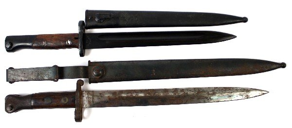 TWO BAYONETS LEE-METFORD MK1 & MODEL 1924 MAUSER: WWII-era Yugoslavian Model 1924 Mauser bayonet marked "Preduzece 44" in Cyrillic with unmatched numbers on scabbard. Dated 1944. 9.5 inch, single fuller, blued blade. Rolled steel scabbard. minor dent