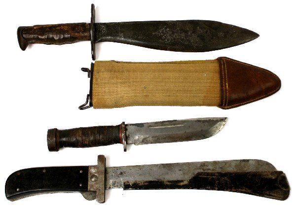 3 US MILITARY KNIVES M1918 MARK 2 & PILOTS MACHETE: Lot of three US Military knives. WWI M 1918 USMC Bolo, manufactured by Plumb Tool Co., with Bauer Bros. 1918 scabbard; WWII Mark 2 USN fighting knife, manufactured by Cattargus, with no scabbard; post