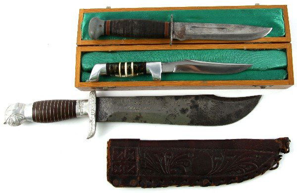 WWII FIGHTING KNIFE LOT IN THEATRE MADE BOWIE: Collection of three WWII and post-War knives, includes unmarked Camillus-style fixed blade without sheath, a Bowie 16 inches overall with blade etched Martin Air Base Philippines with sheath, and a 9.