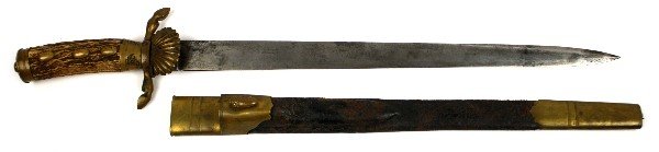 IMPERIAL GERMAN HUNTING HIRSCHFANGER CUTLASS: Imperial German hirschfanger hunting cutlass. 17 inch blade, acid etched C. Beyerhaus Hoflieferant, Potsdam. Antler grip with brass fittings clamshell guard, and hoof quillon. Leather scabbard with br