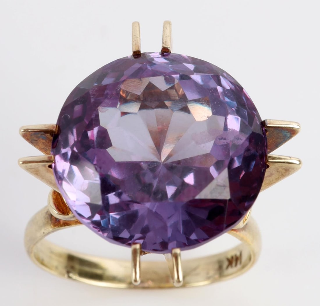 12.16 CARAT PURPLE SAPPHIRE 14K YELLOW GOLD RING: Stamped "14K" inside shank. Total weight 7.4 grams. In very good condition. Ring size 7. This lot has a reserve.