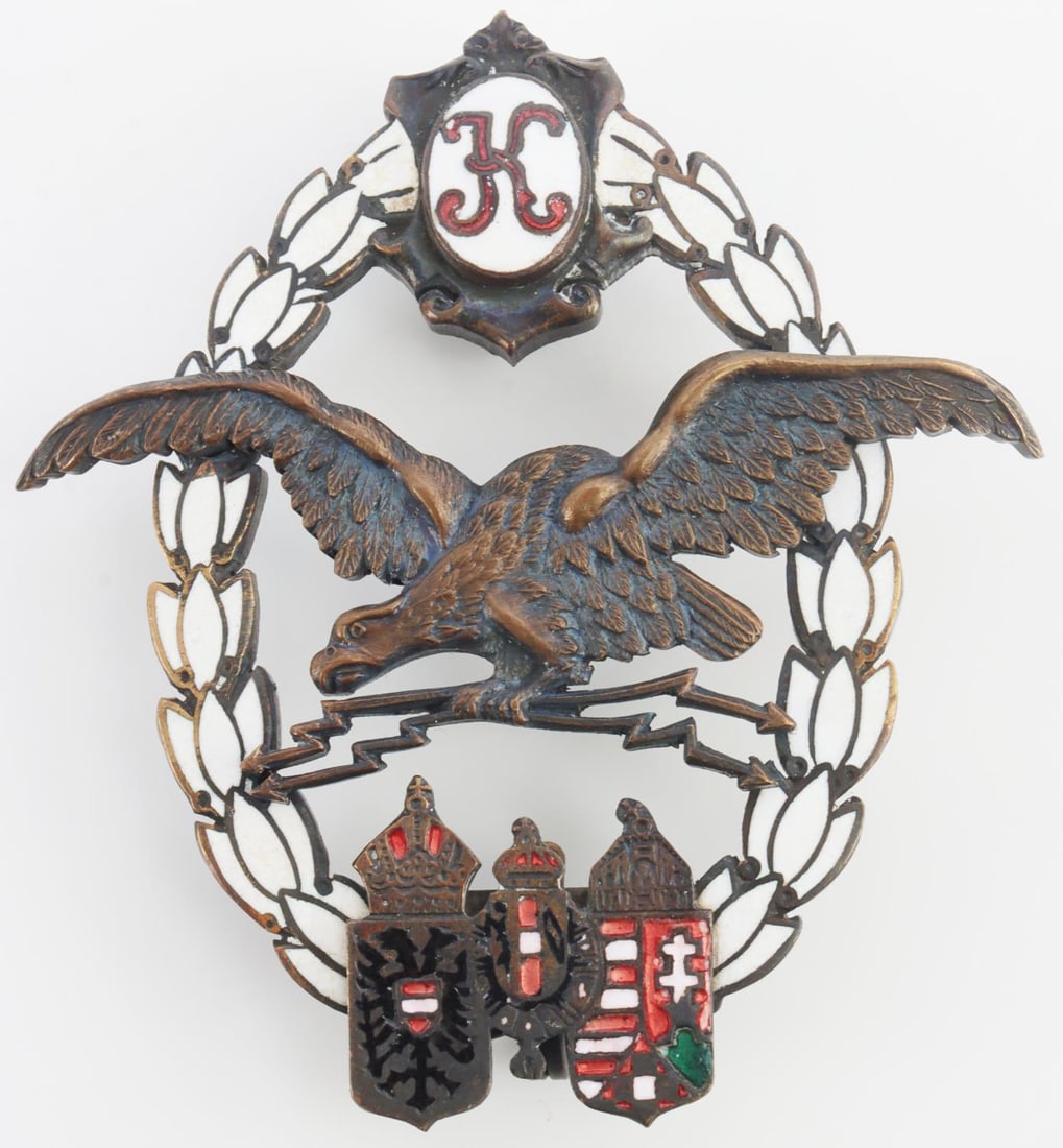 WWI AUSTRIAN HUNGARIAN PILOT AIR OBSERVERS BADGE: Austria Hungary Pilot Observer badge with radio designation. Kaiser Karl Cypher at top. Clasps on top and bottom. BWS maker. Very good condition. Measures 2 1/4 inches.